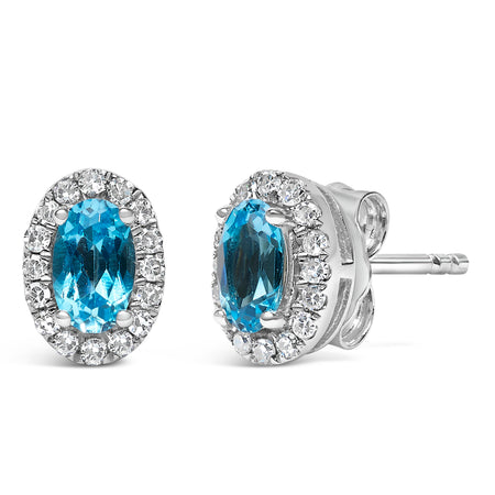 10K White Gold 5x3 MM Oval Blue Topaz and Diamond Halo Stud Earrings (I-J Color, I1-I2 Clarity) - Model View